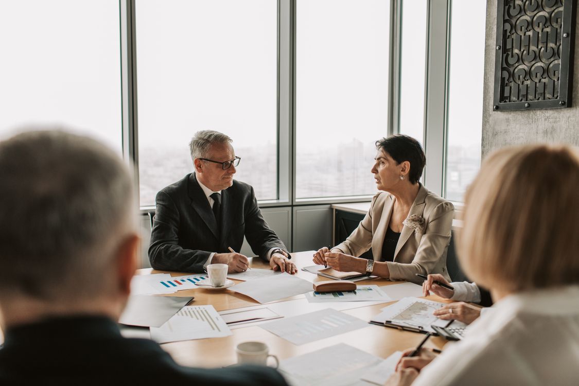 Financial advisor at desk preparing to help clients with succession planning