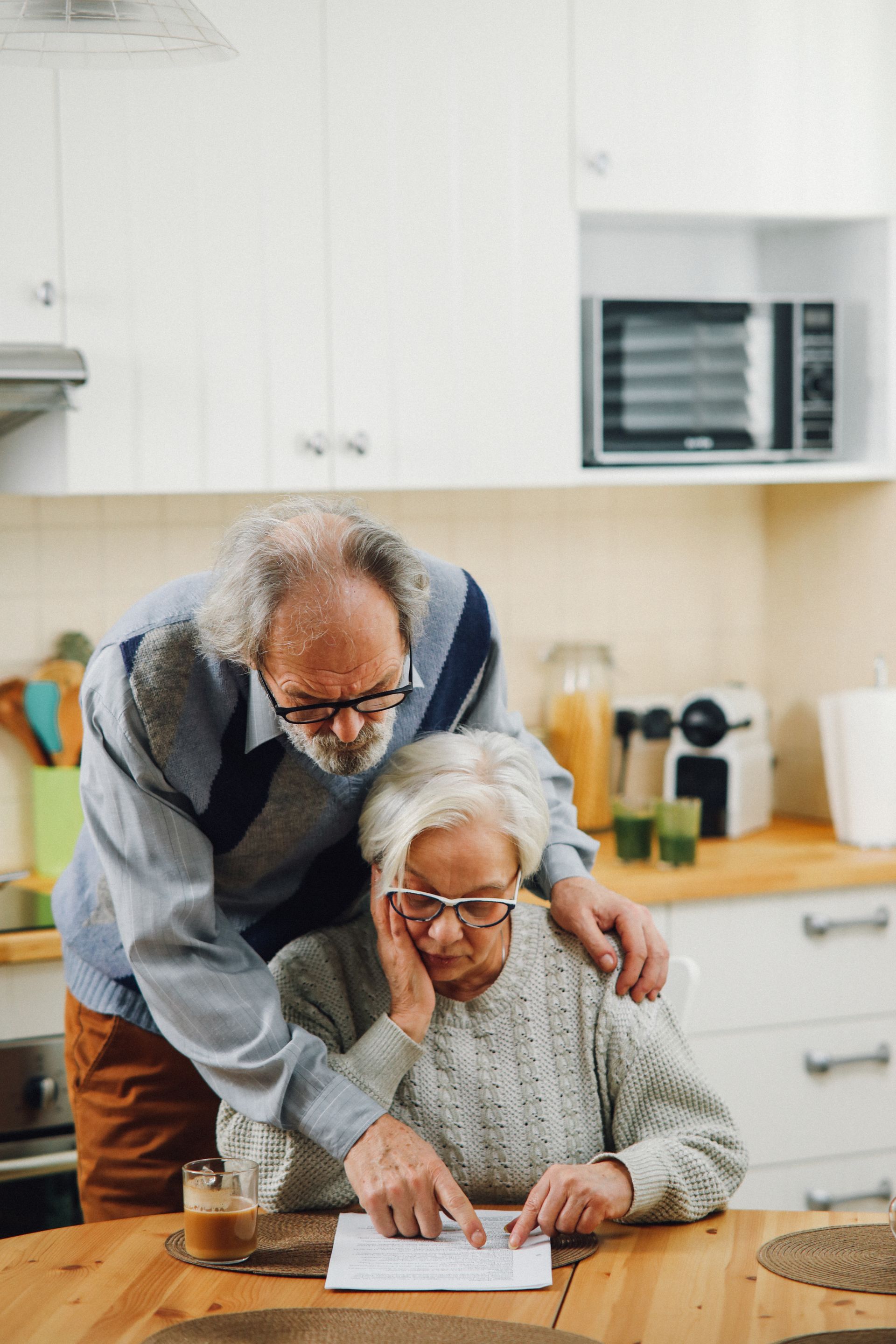 Couple carefully reviewing their financial documents together