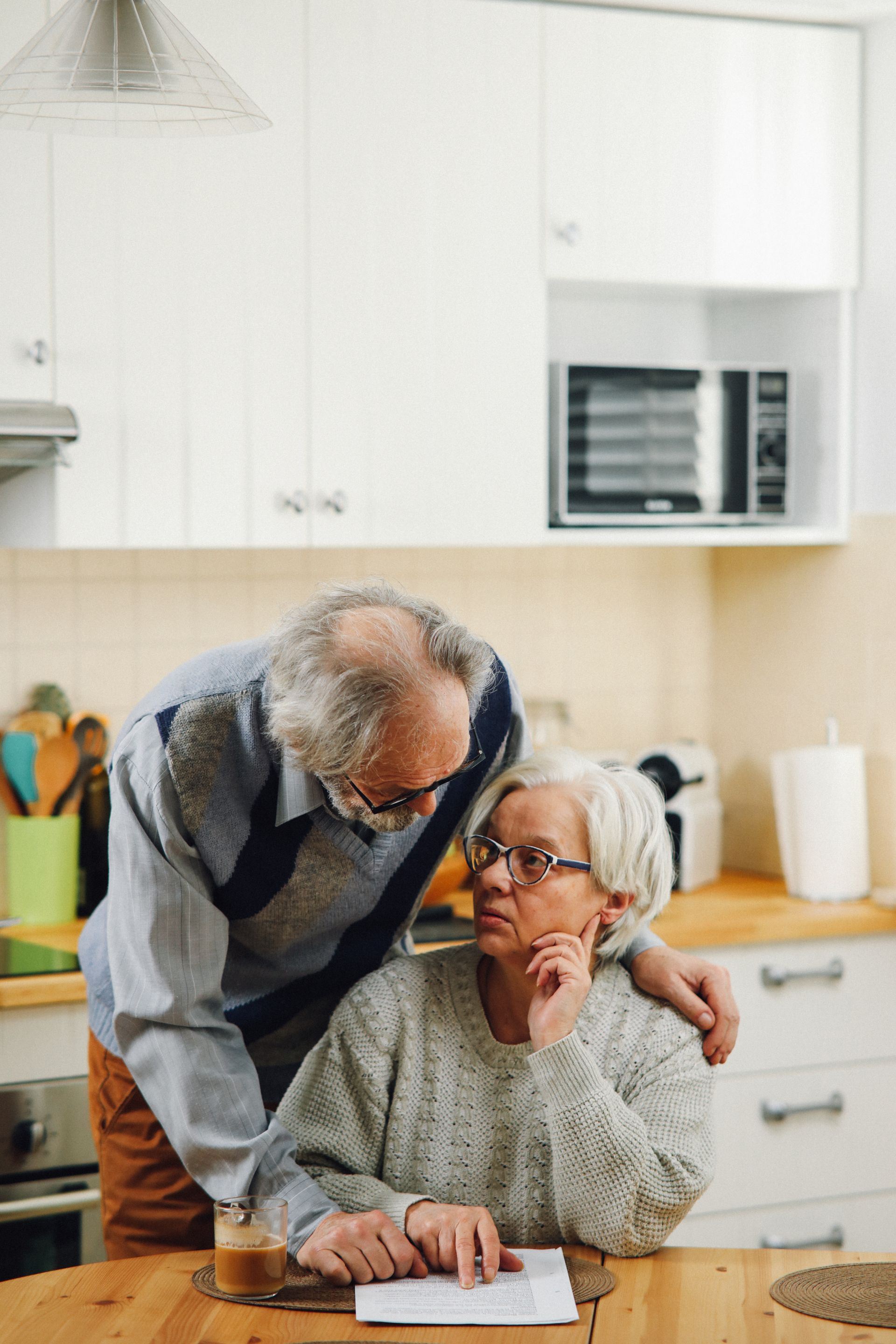 Older couple reviewing important paperwork and planning documents